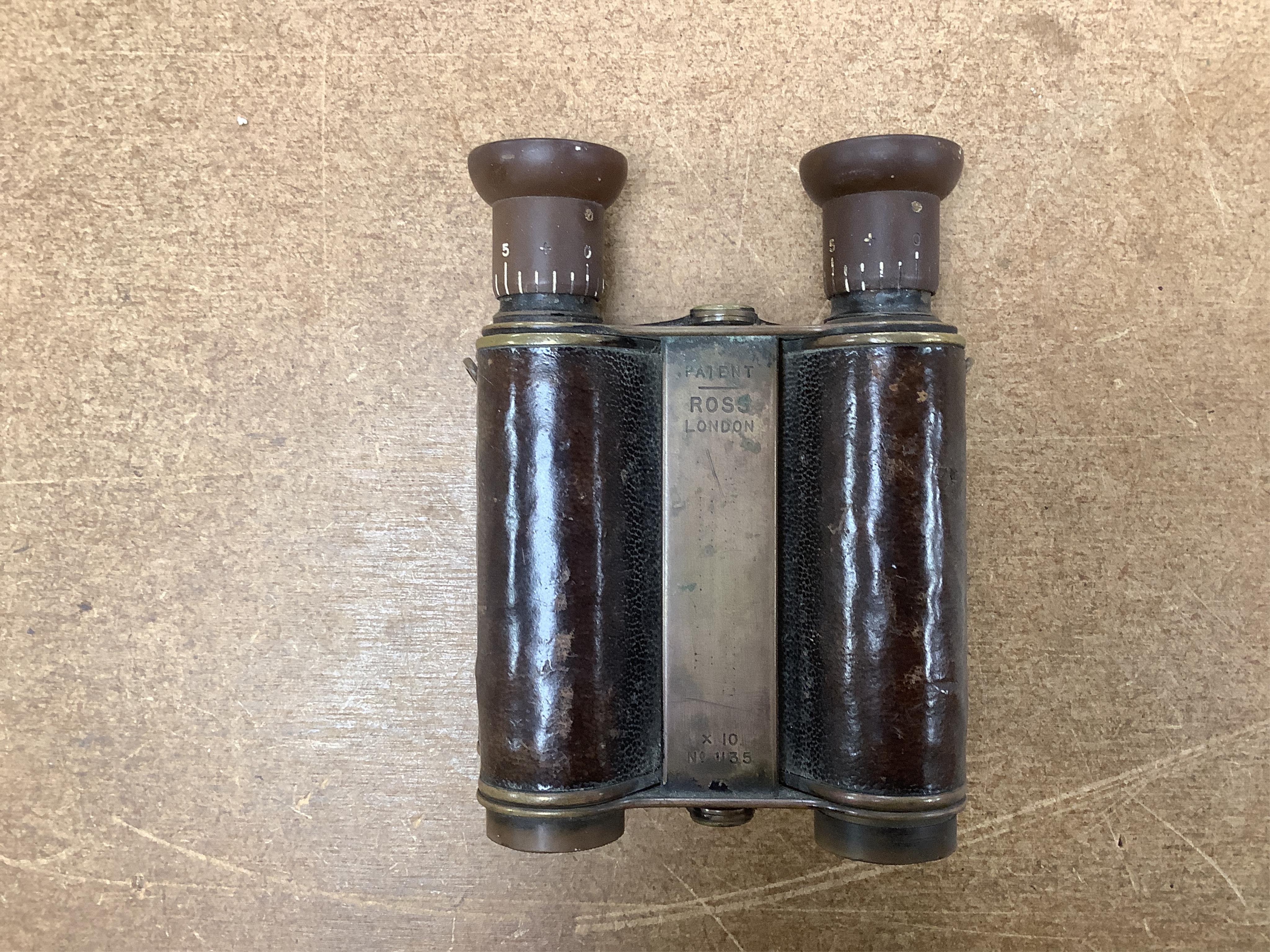 A pair of early Ross binoculars and one other pair of binoculars. Condition - fair